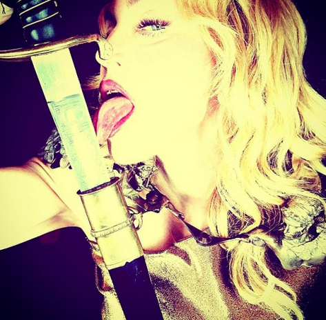 Madonna 2013: Harper´s Bazaar Image with Sword imitating Dec 2012 Images of Susan Elsa´s OTHER PART OF HIM (ARCHANGEL MICHAEL BRAND being built since 2010)